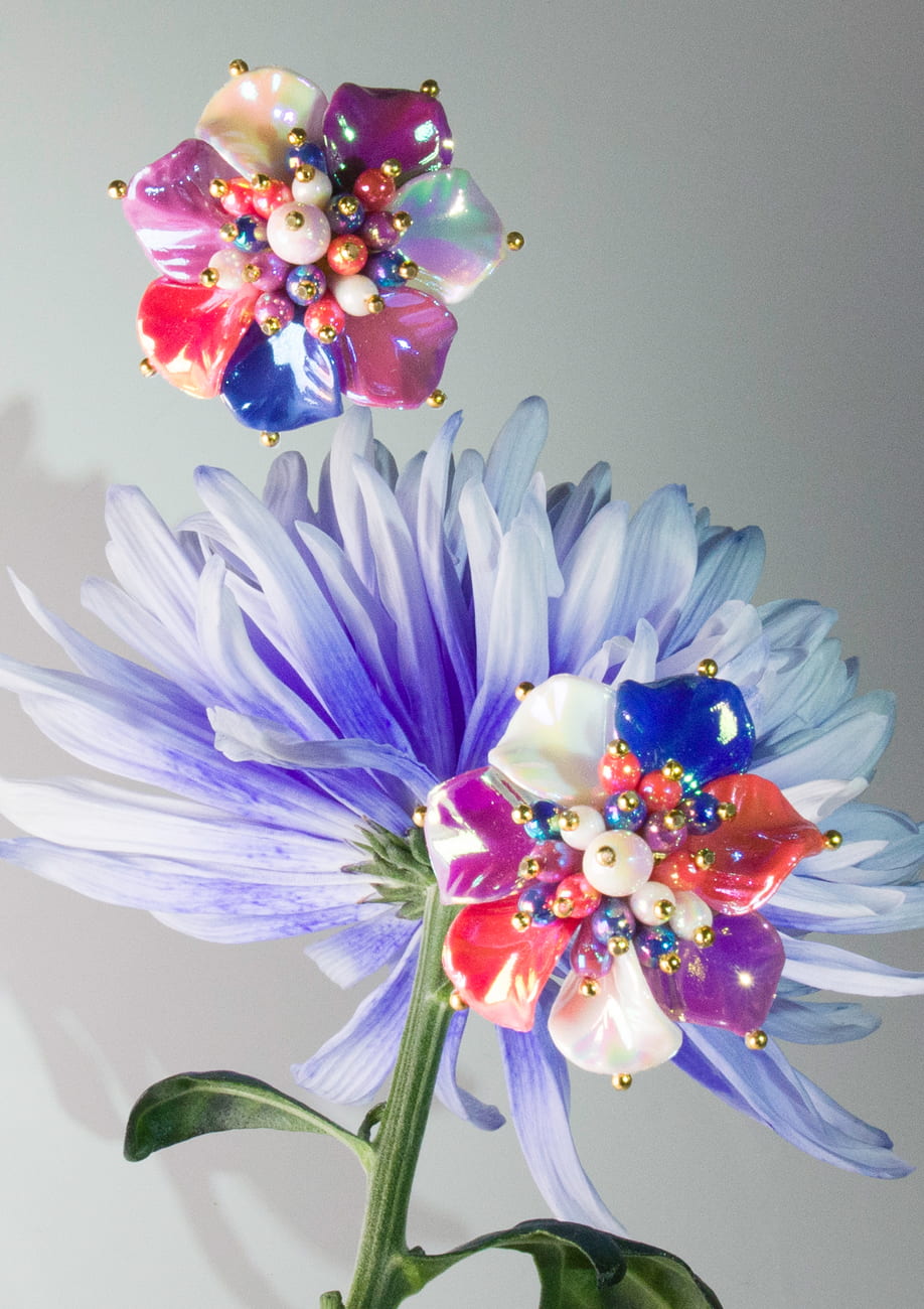 Flower stud earrings on blue flower