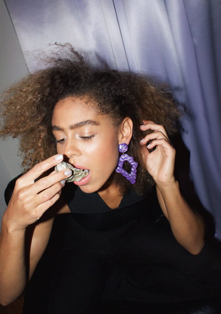 Purple statement earrings by live-to-express on model.