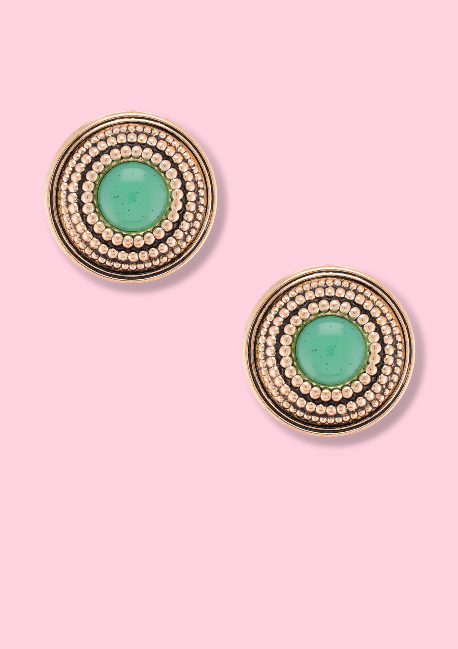 Bohemian style stud earrings in gold with a green stone