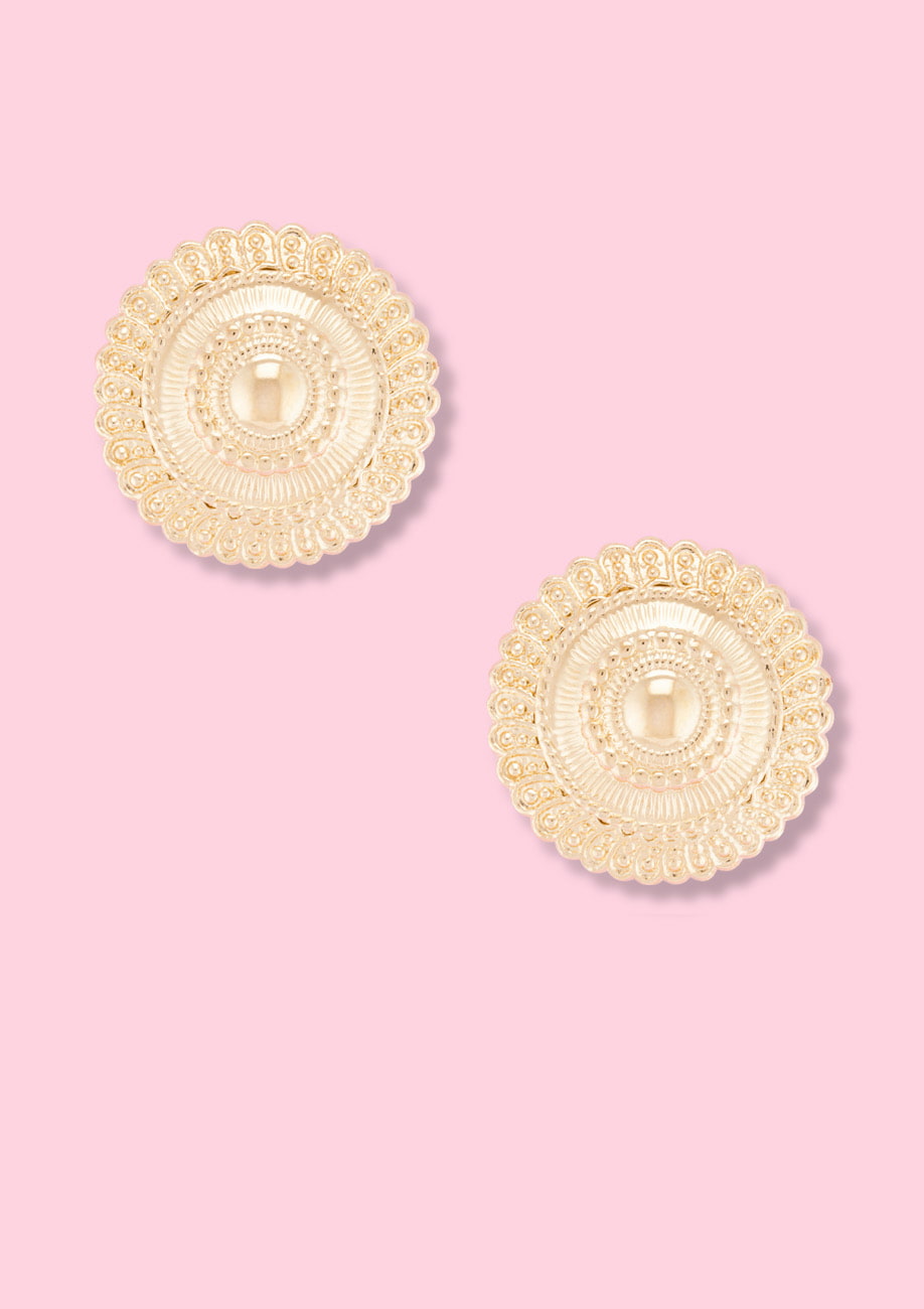 Golden classic clip-on stud earrings, by live-to-express. Shop sustainable vintage earrings online.