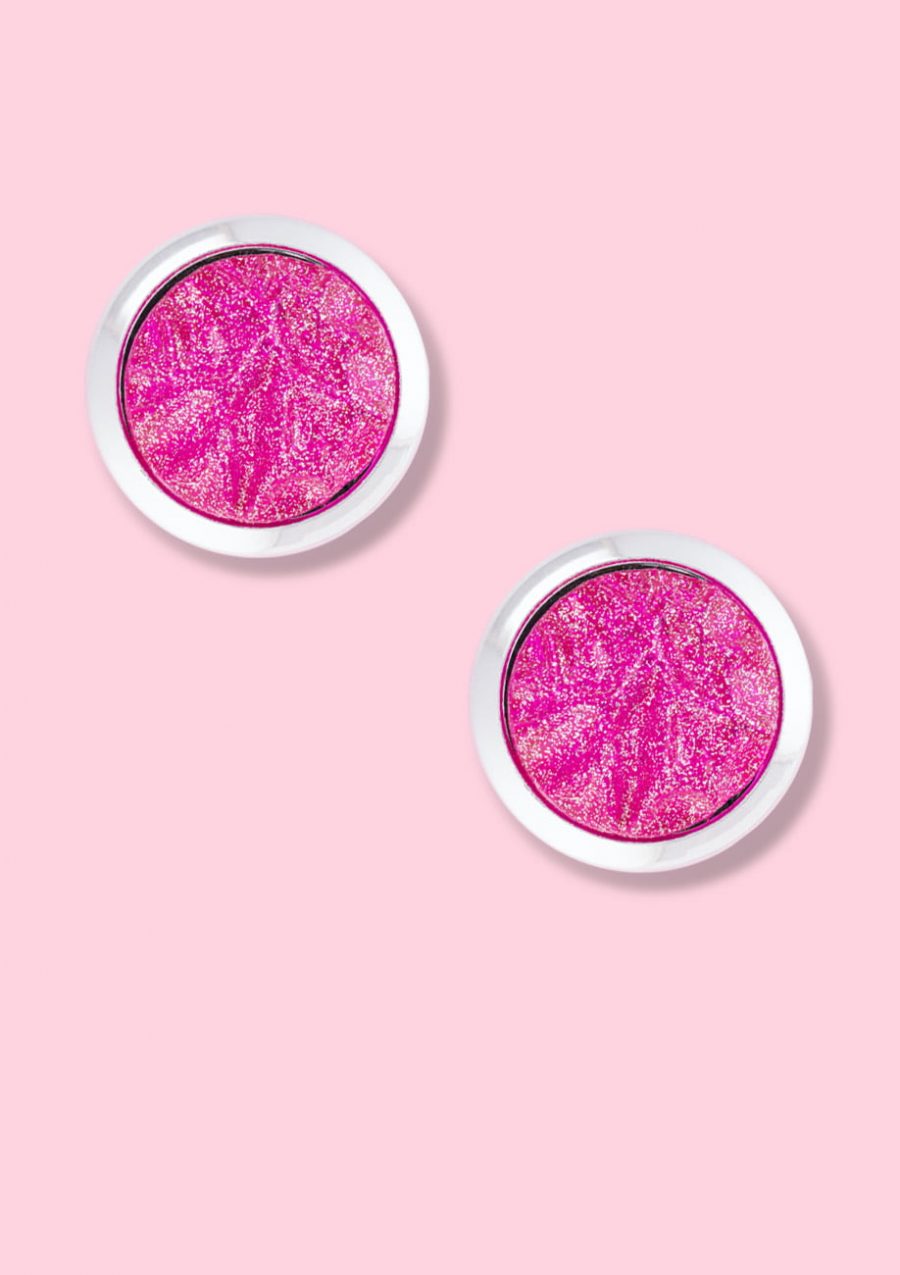 Pink glitter stud earrings with clip-on closing, by live-to-express. Shop 80’s vintage design earrings online.