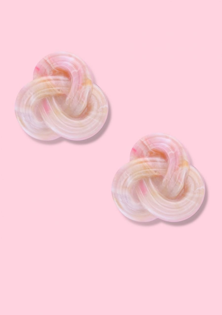 Marbled pink braided stud earrings with clip-on closing, by live-to-express. Shop 70’s vintage design earrings online.