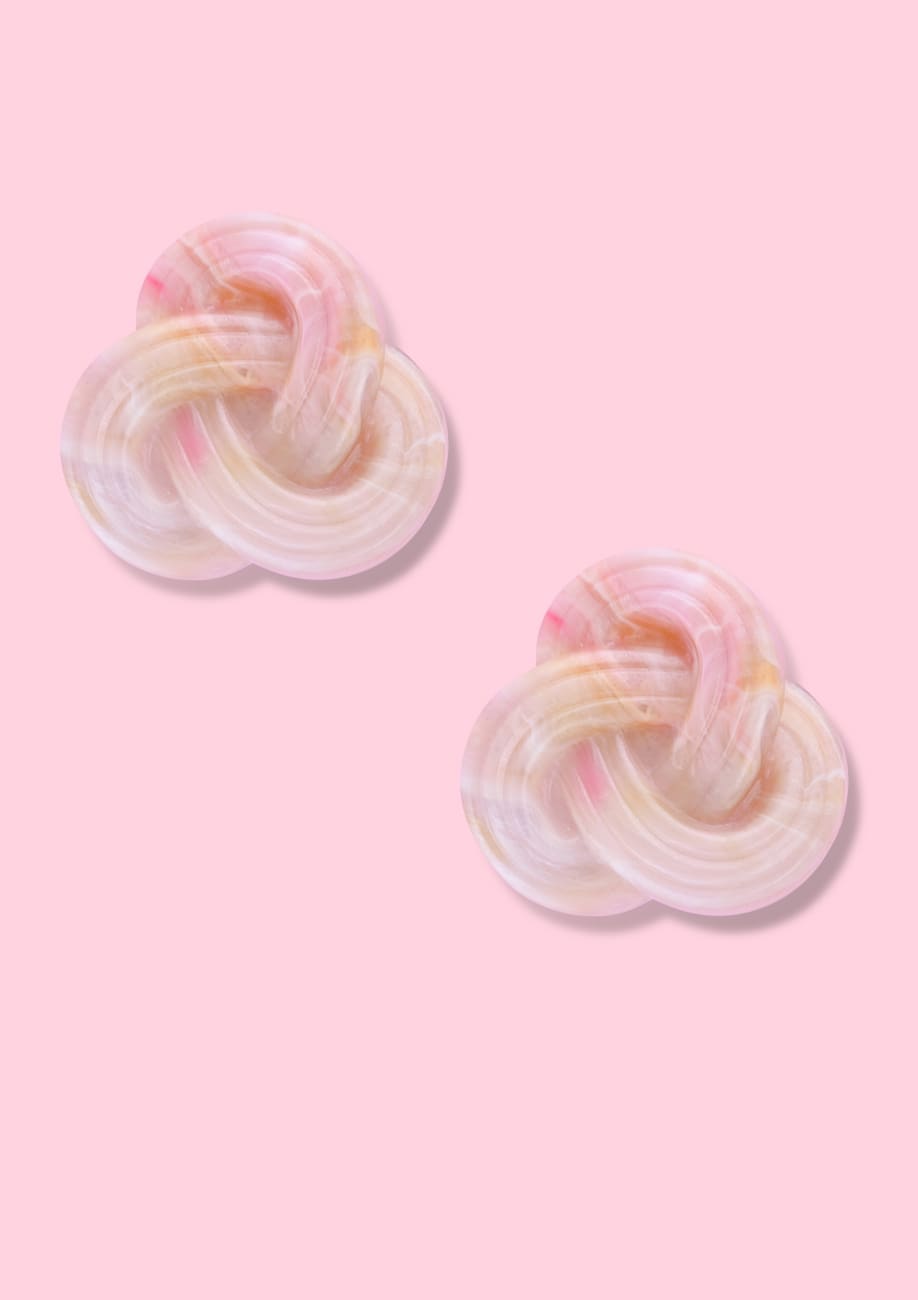 Bold marbled pink braided stud earrings with clip-on closing