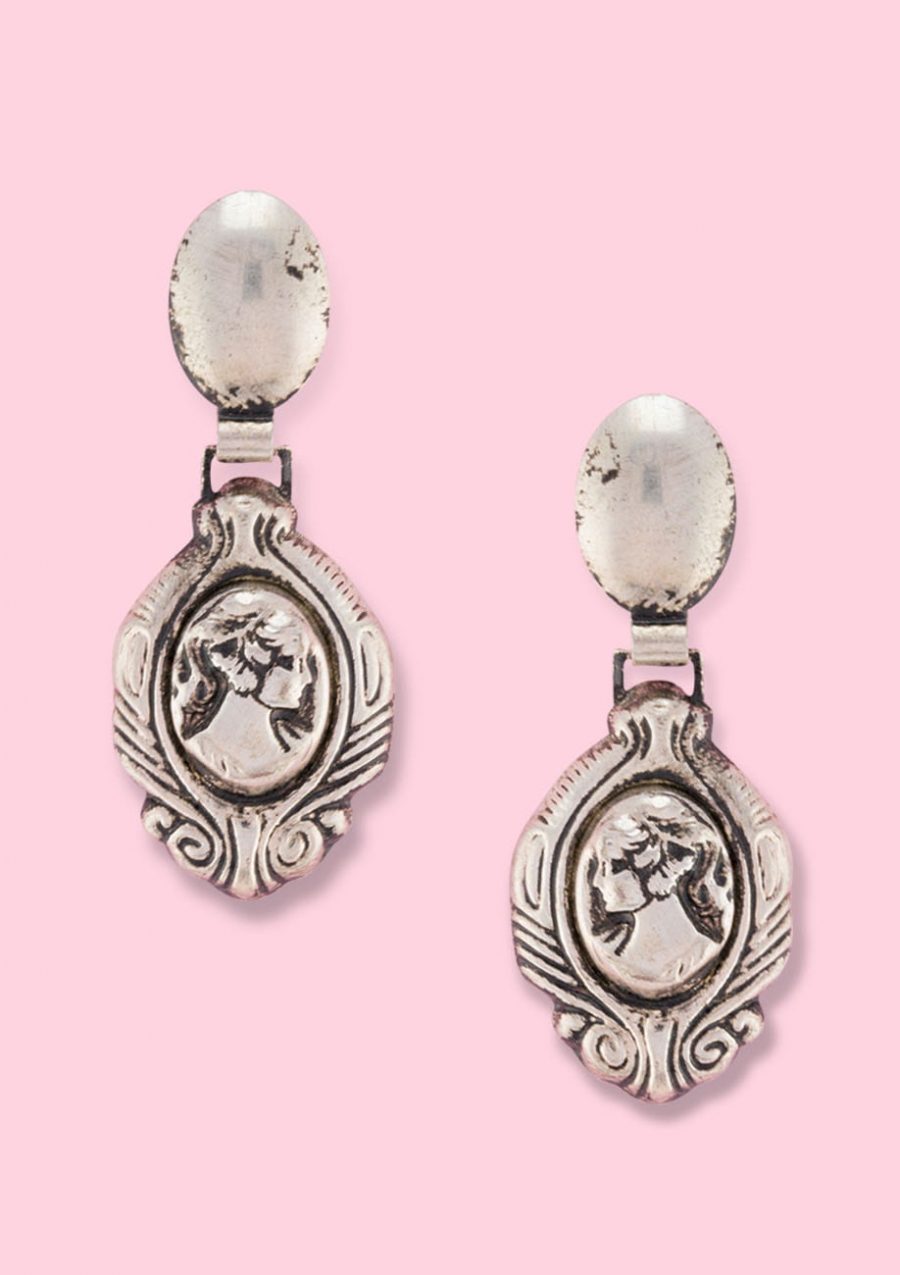 Silver medallion drop earrings with push-back closing, by live-to-express. Shop 60’s vintage earrings online.