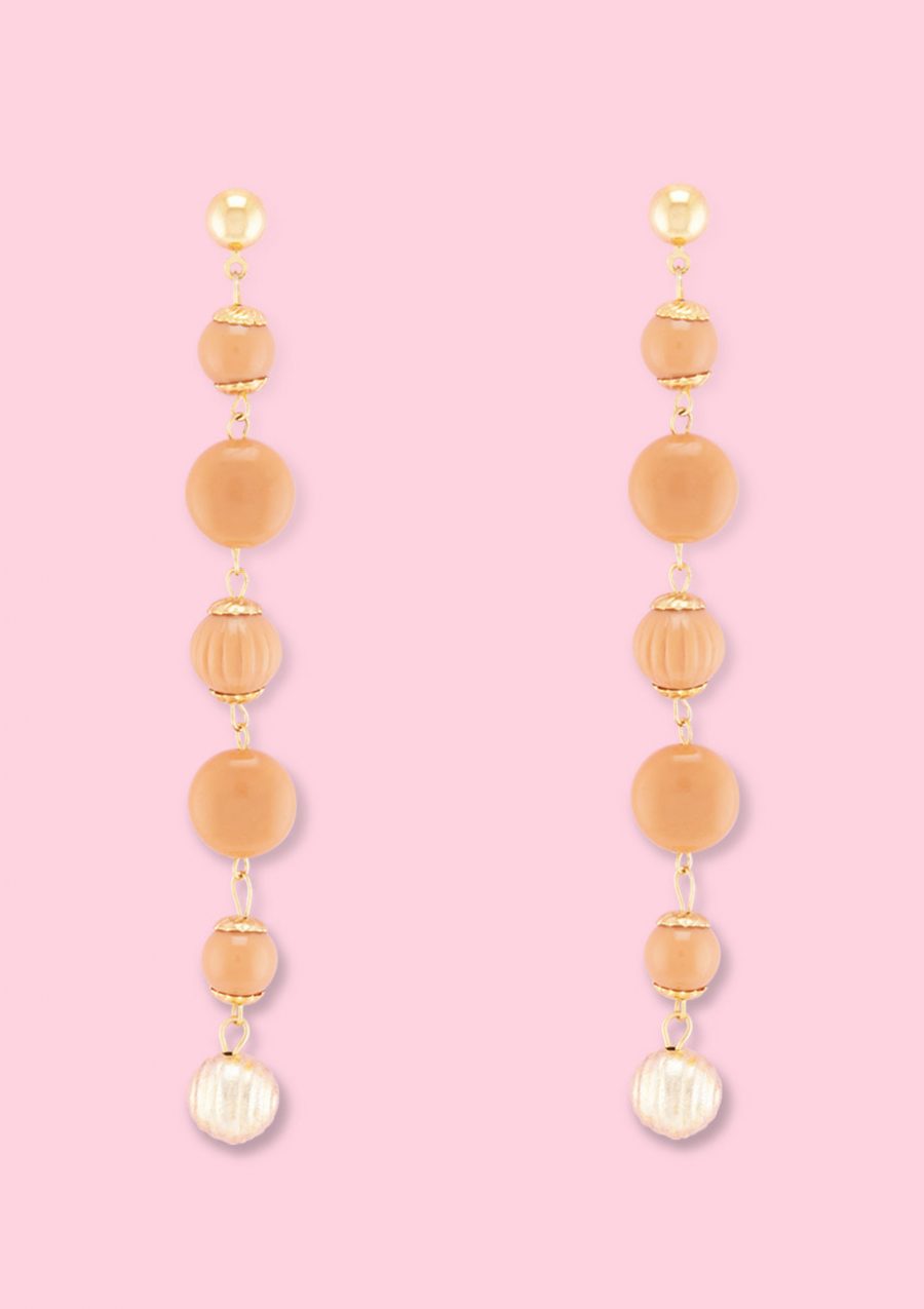 Orange vintage dangle earrings by live-to-express. Shop vintage push-back earrings online.