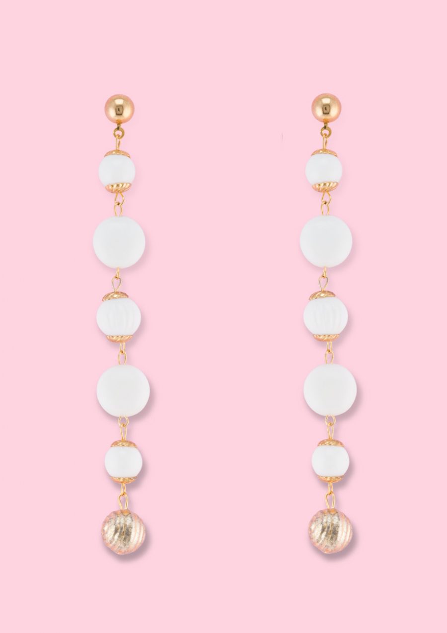 White vintage dangle earrings by live-to-express. Shop vintage push-back earrings online.