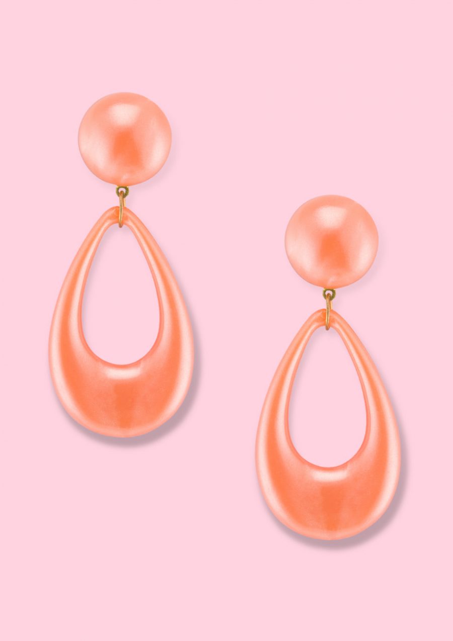 Orange drop earrings with a clip closing