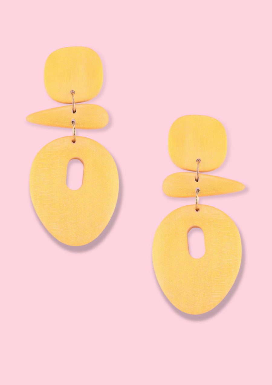 Yellow wooden drop earrings by live-to-express. Shop 70's vintage abstract earrings online.