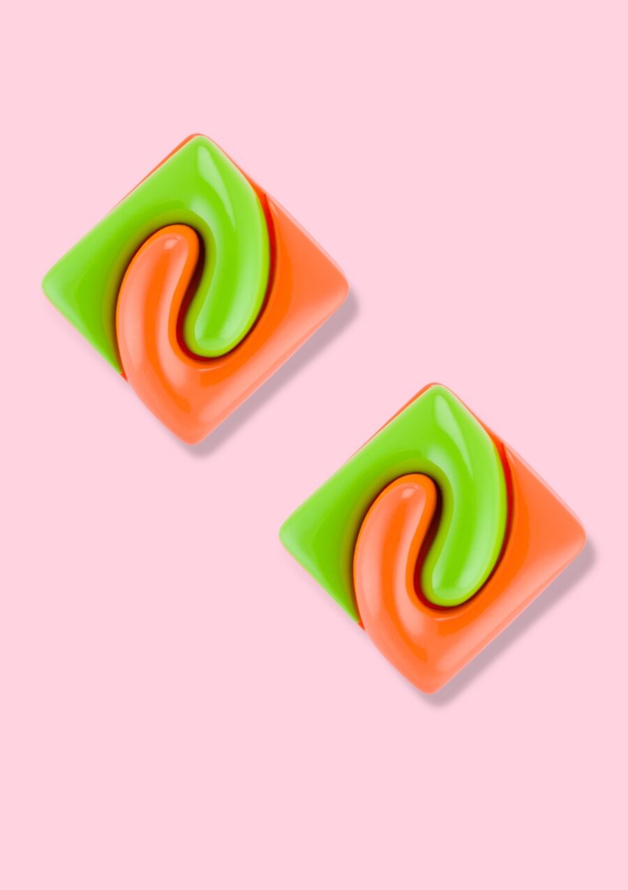 Square green with orange sustainable earrings on a pink background