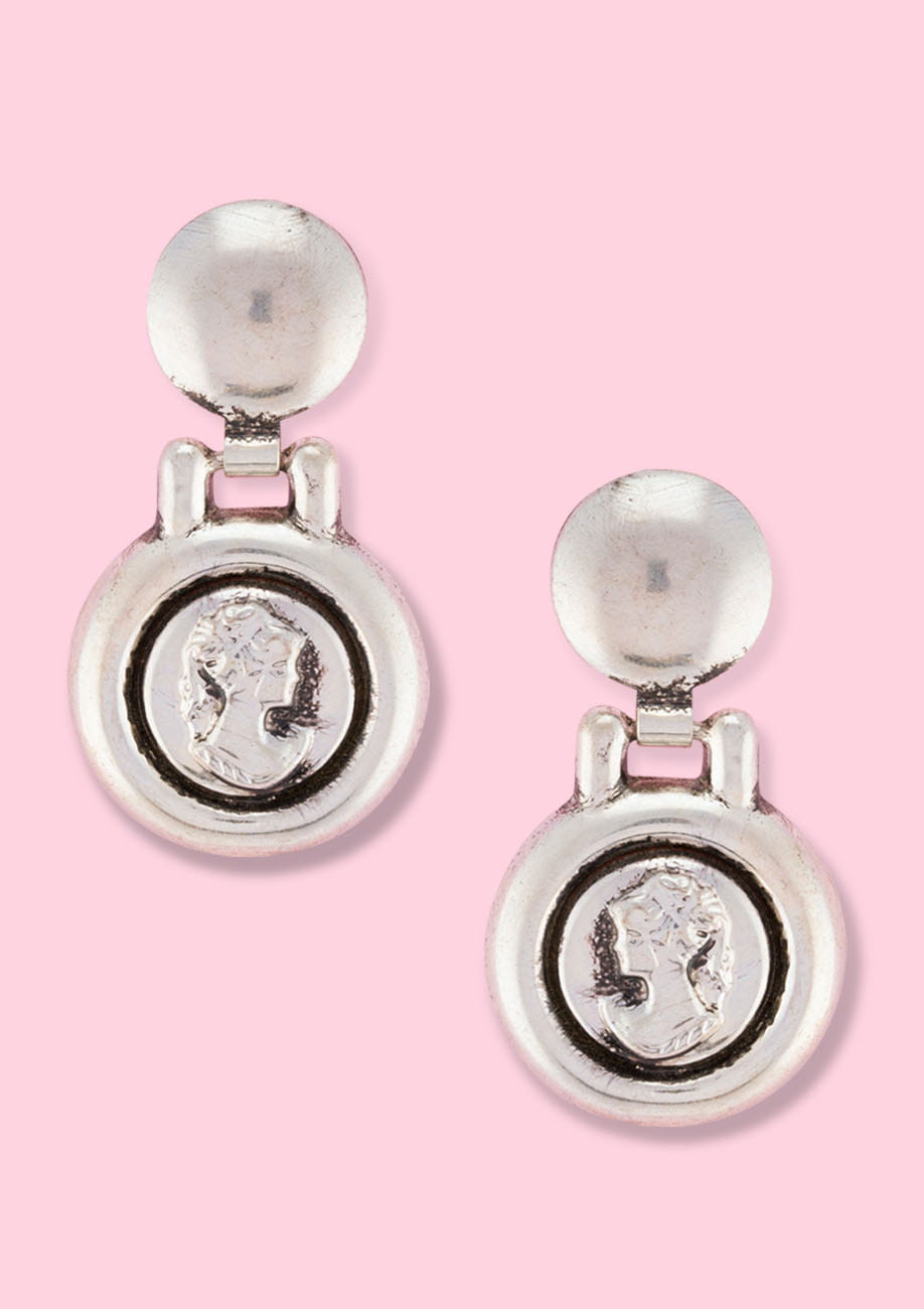Round silver medallion drop earrings with push-back closing, by live-to-express. Shop 60’s vintage earrings online.